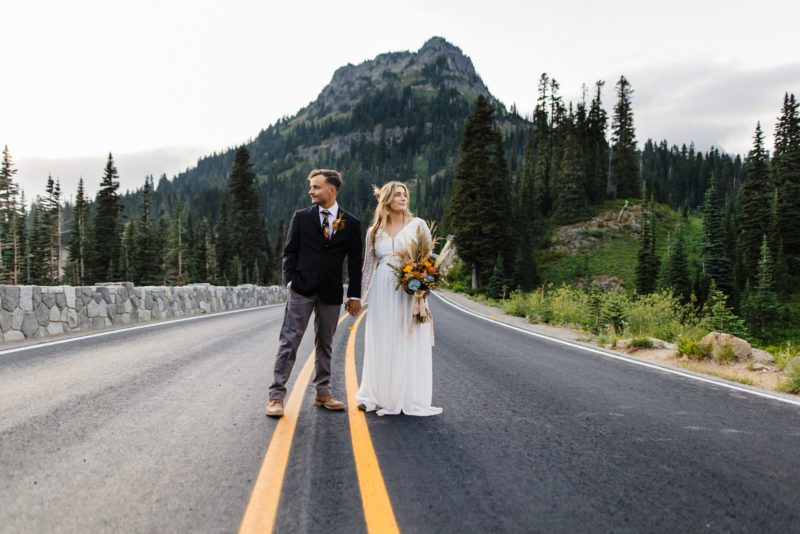 Eloping couple on the road at Mount Rainier National Park